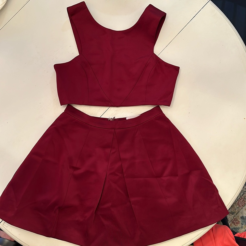 Burgundy 2 piece outfit. Mini skirt with cropped top. Size M, worn maybe twice.